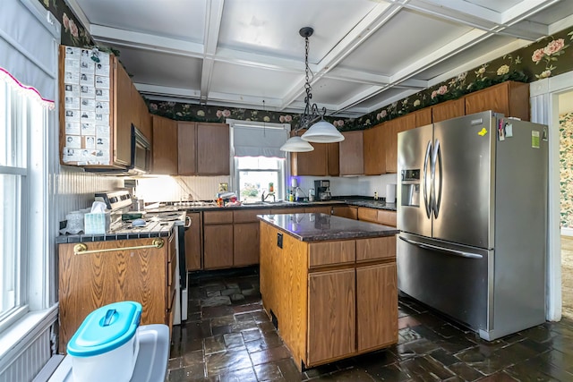 kitchen featuring stainless steel fridge, stone tile floors, a kitchen island, and coffered ceiling
