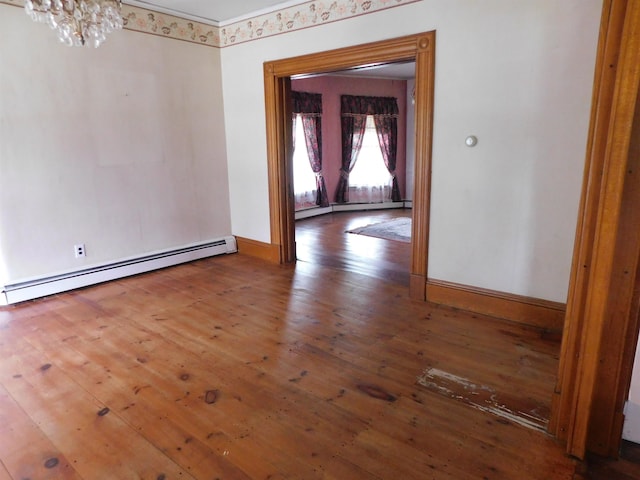 2 N Main St, Mont Vernon, NH 03057 - spare room with a baseboard heating unit, hardwood / wood-style floors, a chandelier, and baseboards