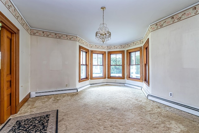 carpeted empty room with a baseboard heating unit, baseboards, and a chandelier