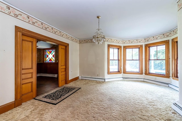unfurnished room with a baseboard radiator, a baseboard heating unit, carpet floors, baseboards, and a chandelier