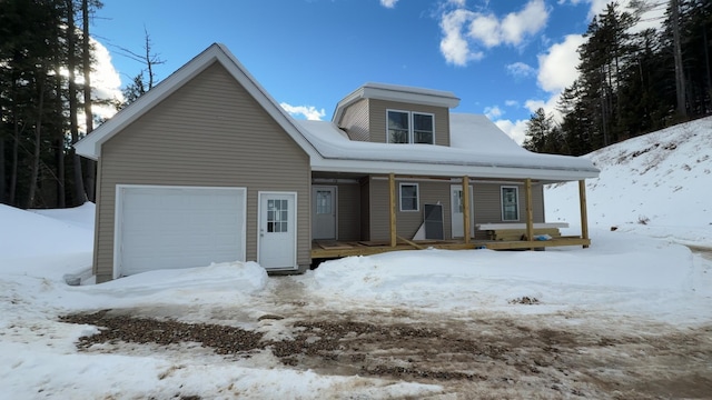 view of front facade featuring covered porch and an attached garage