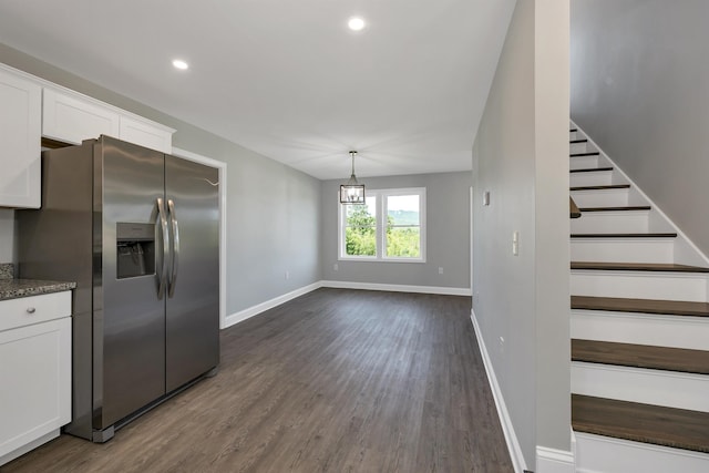 interior space with dark wood-style floors, baseboards, recessed lighting, white cabinets, and stainless steel fridge