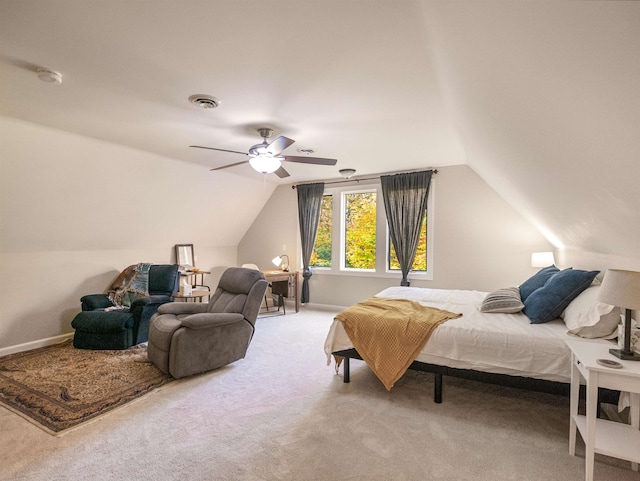 carpeted bedroom with ceiling fan and lofted ceiling