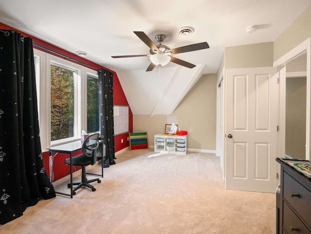 office area featuring ceiling fan, lofted ceiling, and light carpet