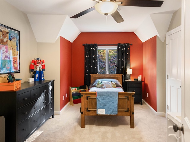 carpeted bedroom with ceiling fan and lofted ceiling