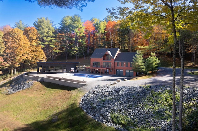 view of swimming pool with a lawn and a patio area