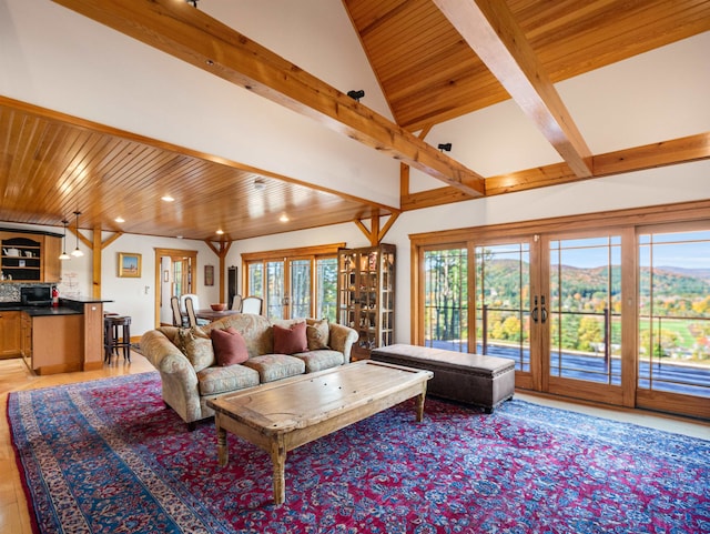 living room featuring french doors, vaulted ceiling with beams, light wood-type flooring, and wooden ceiling