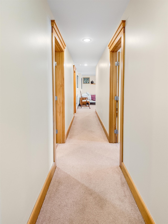 corridor with light carpet