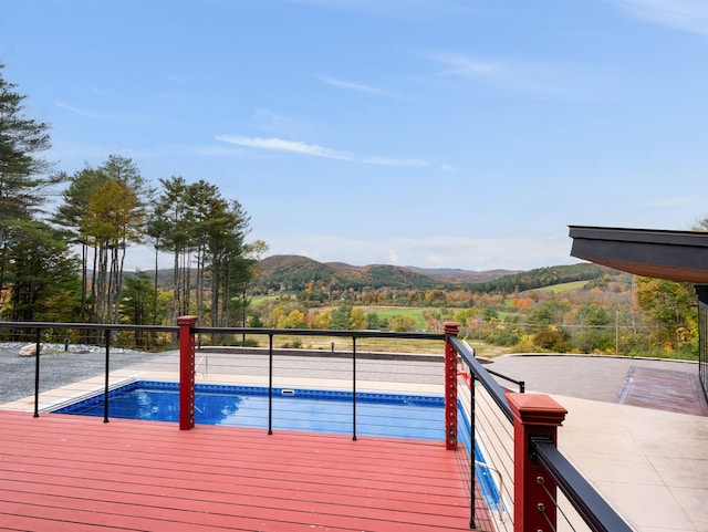 view of pool with a mountain view