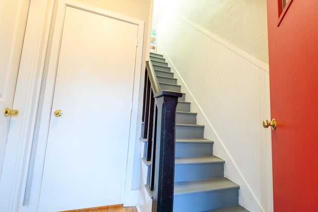 stairway featuring hardwood / wood-style floors