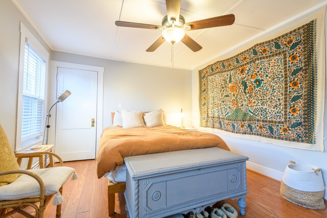 bedroom featuring ceiling fan and hardwood / wood-style flooring