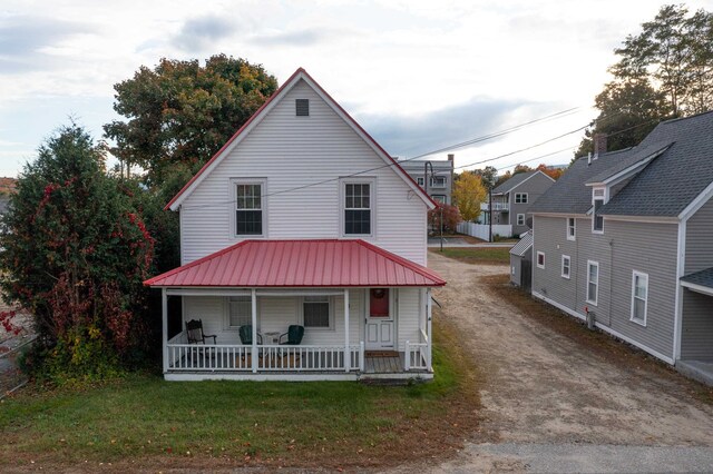 back of house with covered porch