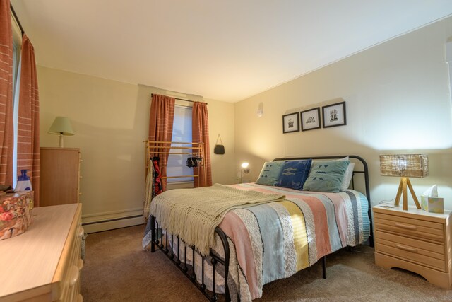 carpeted bedroom featuring a baseboard radiator