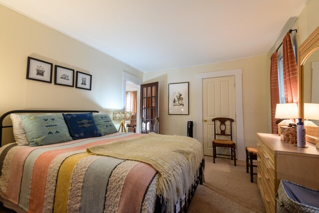 bedroom with light colored carpet