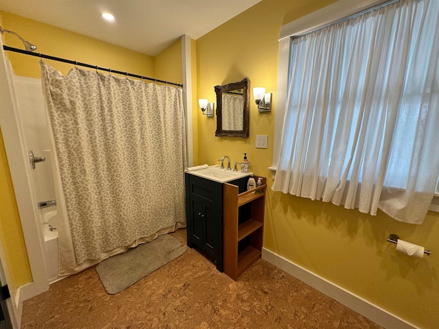 bathroom featuring shower / bath combination with curtain and vanity