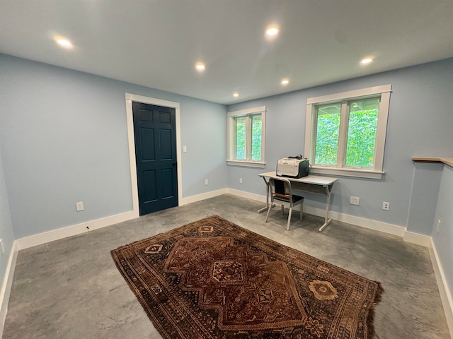 office space featuring concrete flooring