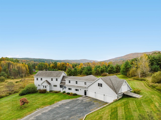 birds eye view of property with a mountain view