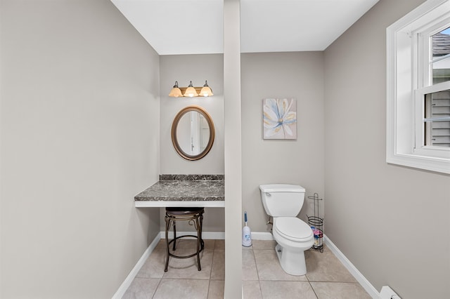 bathroom featuring tile patterned floors and toilet