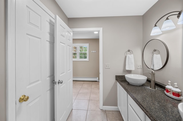 bathroom featuring tile patterned floors, a baseboard radiator, and vanity