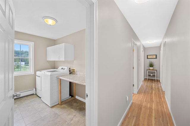 laundry area with washer hookup, cabinets, light hardwood / wood-style floors, and baseboard heating