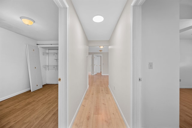 hallway featuring light hardwood / wood-style flooring