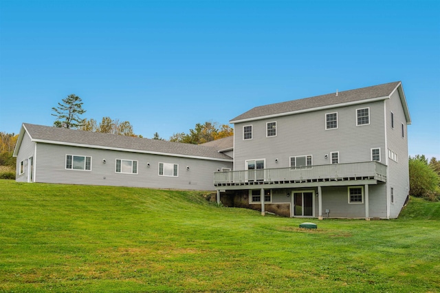 back of house with a yard and a wooden deck