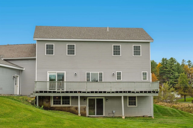 back of property featuring a lawn