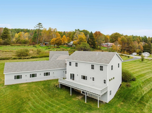 rear view of house with a lawn