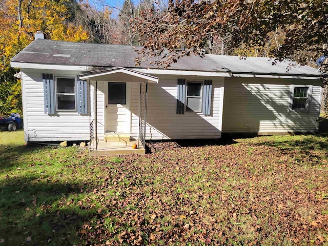 view of front of home with a front yard