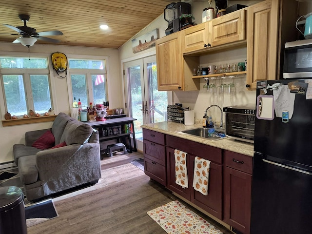 kitchen with french doors, wood ceiling, wood-type flooring, sink, and black refrigerator