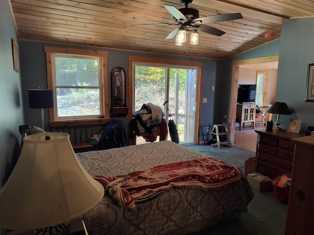 bedroom with ceiling fan, vaulted ceiling, and wooden ceiling