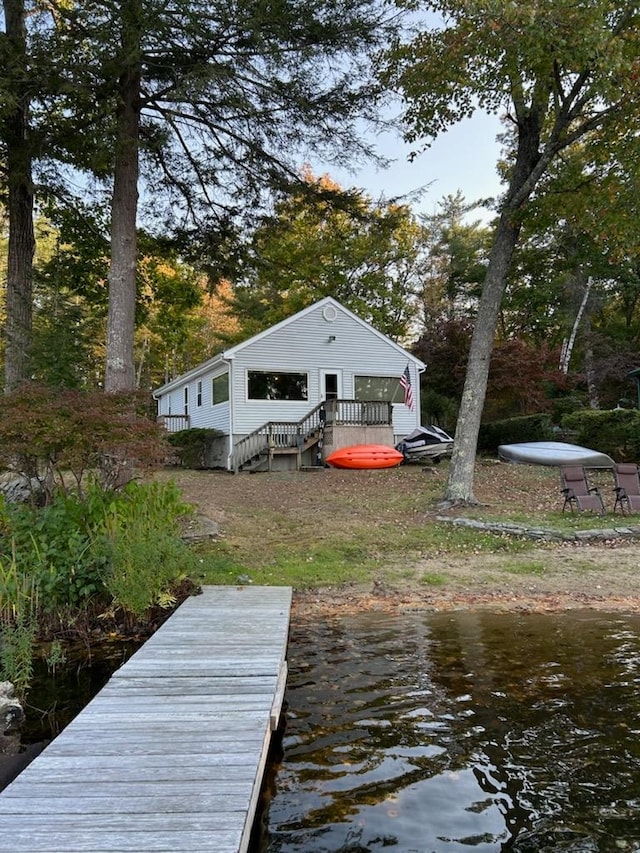 exterior space with a deck with water view