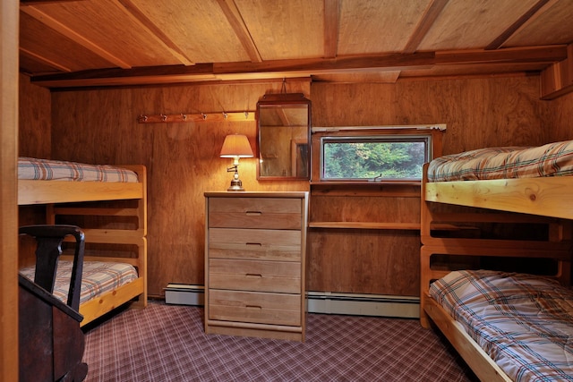 bedroom featuring a baseboard radiator, wooden walls, and wood ceiling