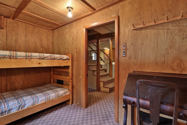 bedroom with wooden walls