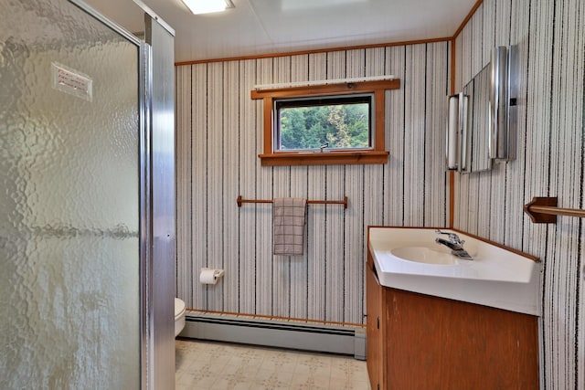 bathroom with vanity, an enclosed shower, ornamental molding, toilet, and baseboard heating