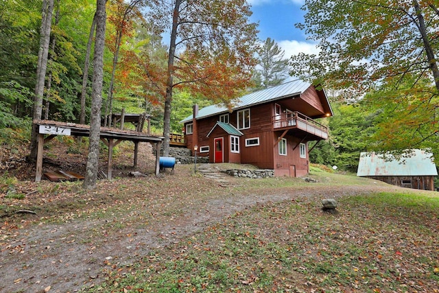 view of side of property with a balcony