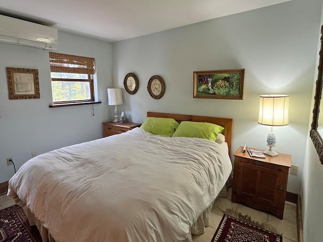 bedroom featuring an AC wall unit