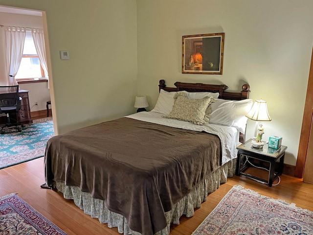 bedroom with light hardwood / wood-style flooring