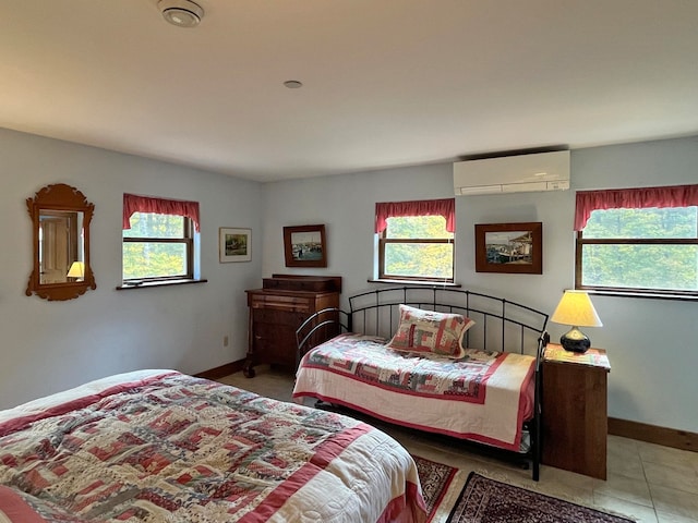 tiled bedroom featuring a wall mounted AC