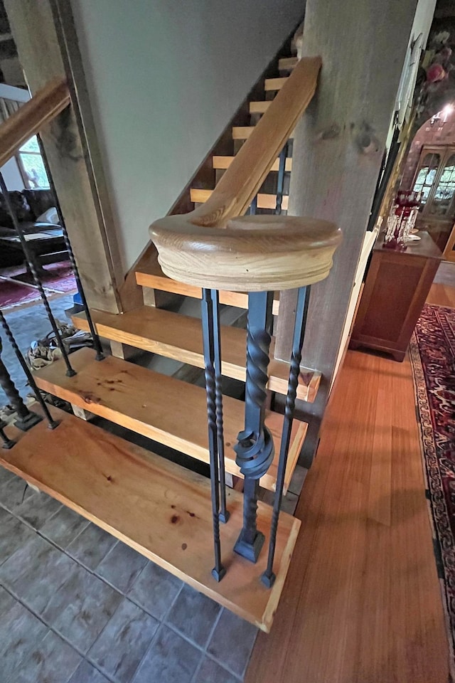 stairs featuring tile patterned flooring