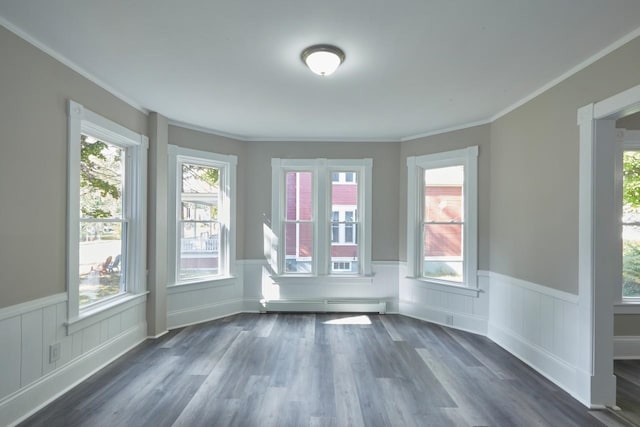 unfurnished sunroom with a baseboard heating unit