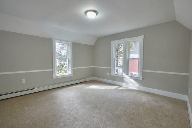 additional living space with light colored carpet, a baseboard radiator, and lofted ceiling