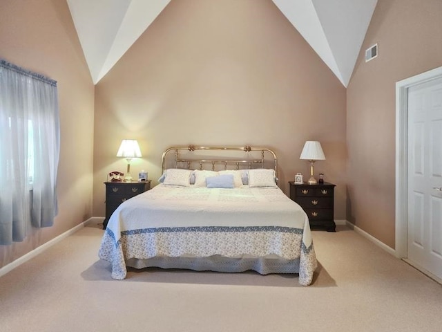 bedroom featuring lofted ceiling and carpet flooring