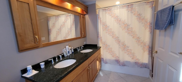 bathroom featuring crown molding, shower / bathtub combination with curtain, and vanity