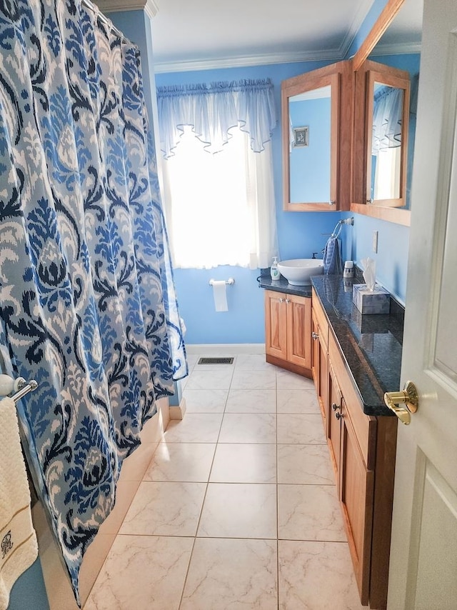 bathroom featuring vanity and crown molding