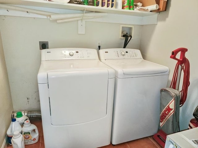 clothes washing area with washer and dryer