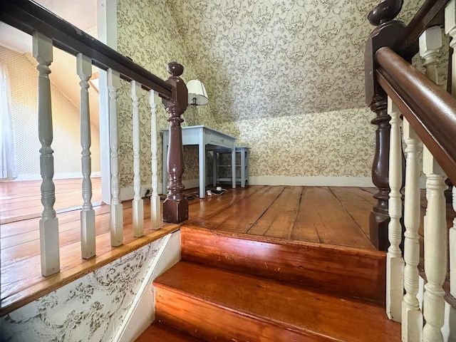 room details featuring carpet flooring, a textured ceiling, and wallpapered walls