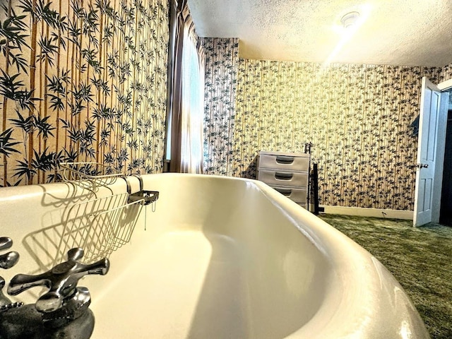 bathroom with vanity, baseboards, toilet, and wallpapered walls