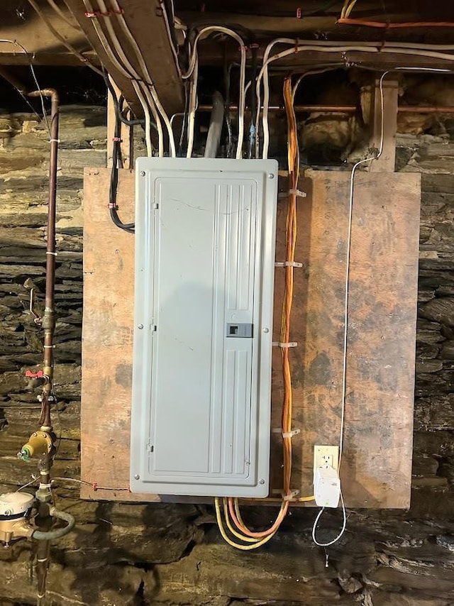 utility room featuring gas water heater