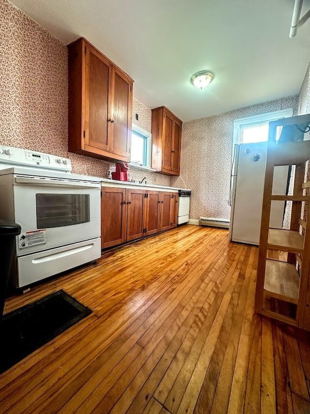 bathroom featuring speckled floor, a baseboard heating unit, toilet, and curtained shower